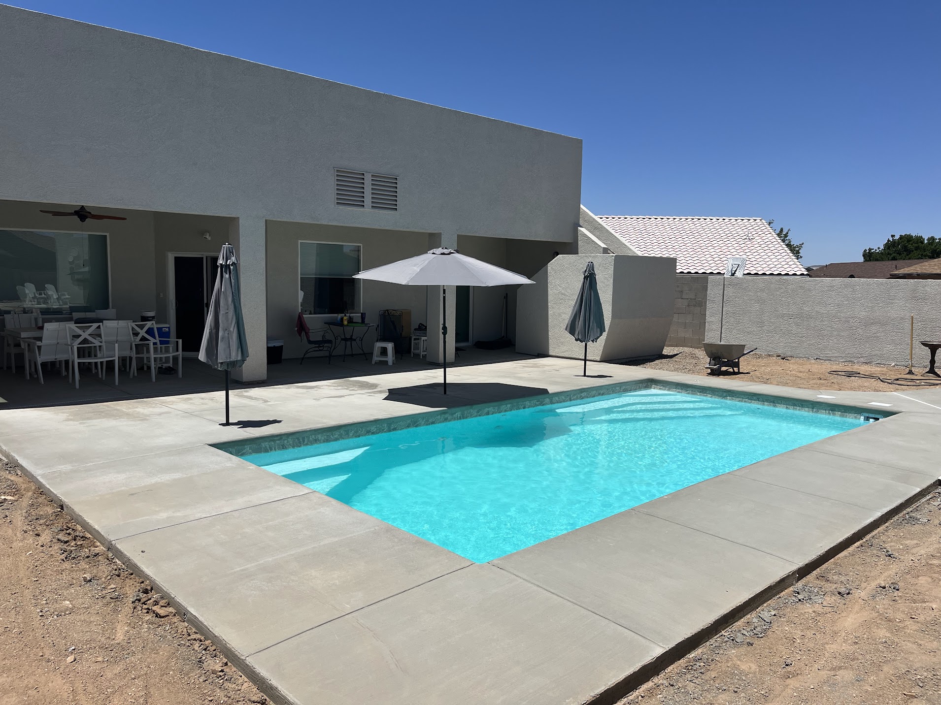 Custom backyard pool with desert landscaping
