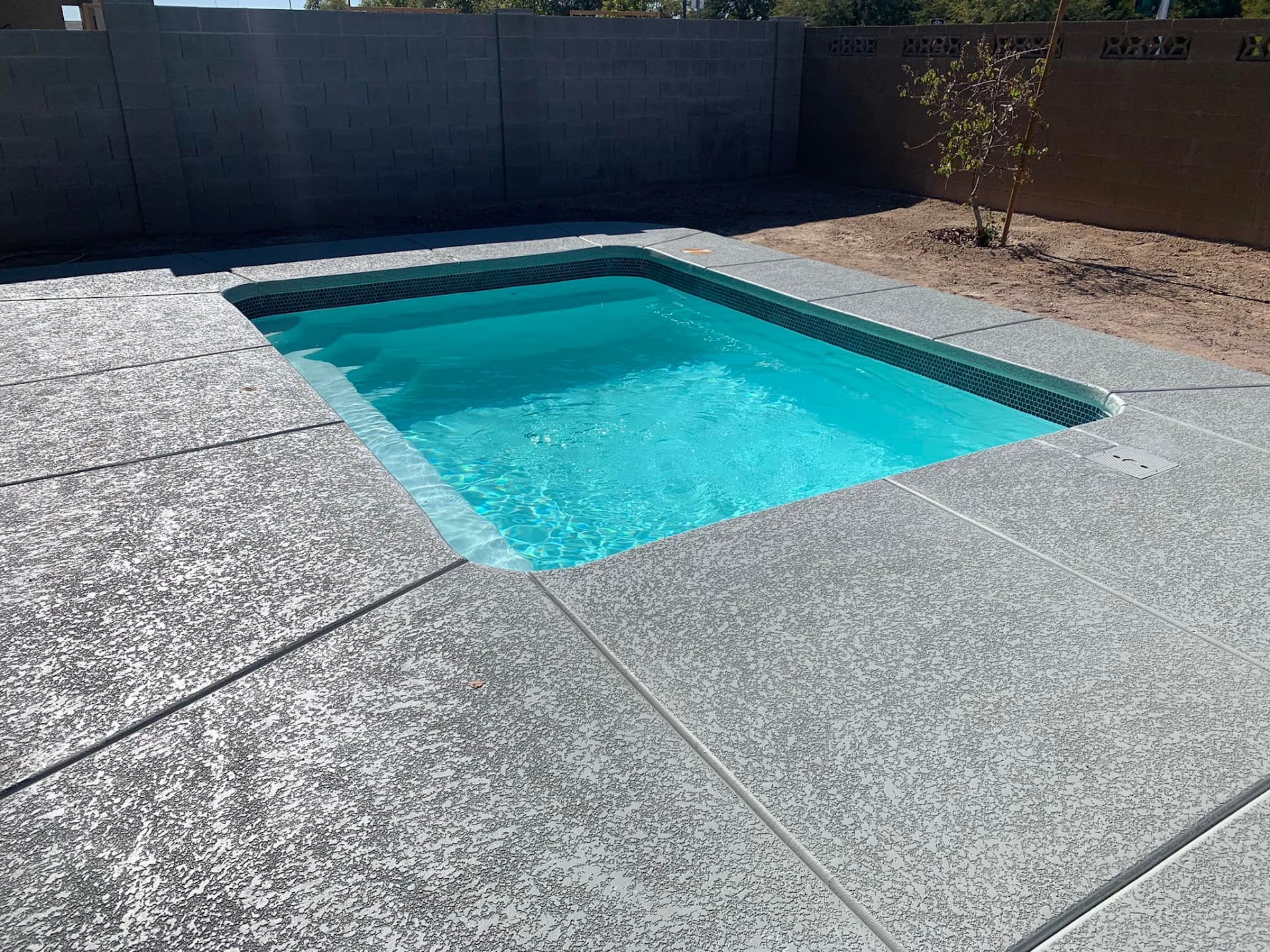 Finished pool project with outdoor living area