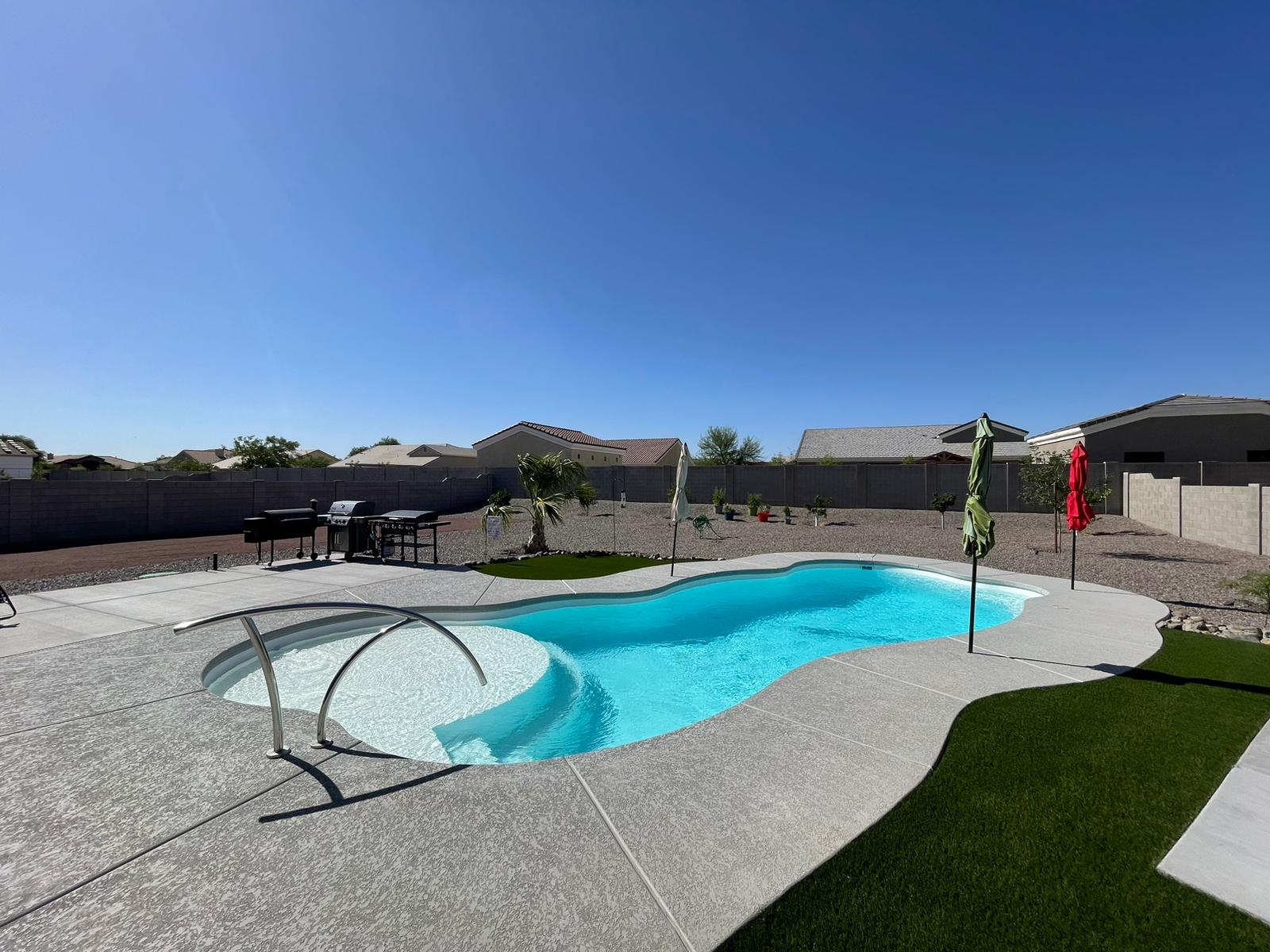 Fiberglass pool installation with paver deck